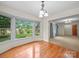 Bright dining area with hardwood floors, a bay window, and open access to adjacent rooms, ideal for entertaining at 2831 Puetts Chapel Rd, Bessemer City, NC 28016