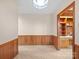 Inviting dining room features wood paneling and a built-in display cabinet at 2831 Puetts Chapel Rd, Bessemer City, NC 28016