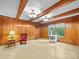 Inviting living room featuring wood paneling and natural light at 2831 Puetts Chapel Rd, Bessemer City, NC 28016