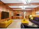 Stylishly furnished living room with wood paneling, comfortable seating, and ample lighting at 2831 Puetts Chapel Rd, Bessemer City, NC 28016