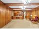 Spacious living room featuring wood paneling and built in shelving at 2831 Puetts Chapel Rd, Bessemer City, NC 28016