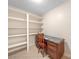 Small office space with built-in shelves and a vintage wooden desk at 2831 Puetts Chapel Rd, Bessemer City, NC 28016