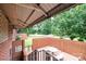 Charming brick patio with seating area and ornate iron railing, perfect for outdoor gatherings at 2836 20Th Street Ne Ln, Hickory, NC 28601