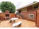 Brick patio with built-in grill and stone table set, ideal for entertaining in the backyard at 2836 20Th Street Ne Ln, Hickory, NC 28601