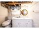 Bathroom with white walls, vanity, commode and decorative gold mirror at 2836 20Th Street Ne Ln, Hickory, NC 28601