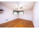 Bedroom with hardwood floors, ceiling fan, and large windows with curtains letting in natural light at 2836 20Th Street Ne Ln, Hickory, NC 28601