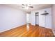 This bedroom boasts gleaming hardwood floors, ceiling fan, and a neutral color palette for a serene feel at 2836 20Th Street Ne Ln, Hickory, NC 28601