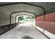A practical carport providing sheltered parking and a view of the home's exterior at 2836 20Th Street Ne Ln, Hickory, NC 28601