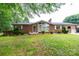 Charming brick home with well-maintained lawn, front porch, and mature landscaping at 2836 20Th Street Ne Ln, Hickory, NC 28601