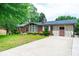 Attractive brick home featuring a covered parking area and lush landscaping, ready for move-in at 2836 20Th Street Ne Ln, Hickory, NC 28601