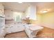 Galley kitchen with white cabinets and retro finishes at 2836 20Th Street Ne Ln, Hickory, NC 28601