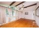 Inviting living room with hardwood floors, large windows, and a vaulted ceiling with exposed beams at 2836 20Th Street Ne Ln, Hickory, NC 28601