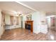 Living room with fireplace, light green walls and opening to kitchen at 2836 20Th Street Ne Ln, Hickory, NC 28601