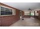Enclosed patio space with ceiling fan, lattice details, and exterior door offering a private retreat at 2836 20Th Street Ne Ln, Hickory, NC 28601