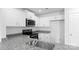 Bright kitchen boasts stainless steel appliances, granite counters, and white cabinetry at 3140 Ora Smith Rd, Lincolnton, NC 28092