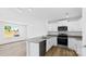 Modern kitchen with stainless steel appliances, granite counters, and wood floors at 3140 Ora Smith Rd, Lincolnton, NC 28092