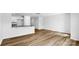 Open concept living space with wood floors and bright, white kitchen with granite countertops at 3140 Ora Smith Rd, Lincolnton, NC 28092