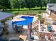 Outdoor dining and lounge areas, plus a fenced in-ground pool at this property at 3509 Flint Dr, Statesville, NC 28677