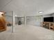 Unfinished basement featuring carpeted floors, exposed ductwork, support beams and fireplace at 3509 Flint Dr, Statesville, NC 28677