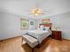 Cozy bedroom with wood floors, a ceiling fan, and two windows with natural light at 3509 Flint Dr, Statesville, NC 28677