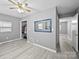 Spacious bedroom with light grey walls, laminate floors, closet and natural lighting at 3509 Flint Dr, Statesville, NC 28677
