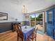Dining area with wood floors and a sliding glass door leading to an outdoor deck at 3509 Flint Dr, Statesville, NC 28677