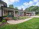 Charming front exterior featuring stone accents, well-maintained landscaping, and covered parking at 3509 Flint Dr, Statesville, NC 28677