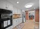 Well-equipped kitchen with stainless steel appliances, tile backsplash, and dark granite countertops at 3509 Flint Dr, Statesville, NC 28677