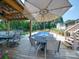 Outdoor patio with dining areas, in-ground pool, and lush landscaping at 3509 Flint Dr, Statesville, NC 28677