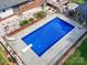 Aerial shot of backyard pool, patio and well maintained landscaping surrounding it at 3509 Flint Dr, Statesville, NC 28677