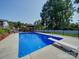 Inviting backyard pool with diving board and adjacent gazebo; great for entertaining and enjoying the outdoors at 3509 Flint Dr, Statesville, NC 28677