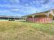 Wide view of a well-kept barn complex with multiple structures and grassy fields at 355 Pelham Ln, Mooresville, NC 28115