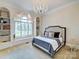 This bedroom features a chandelier, built-in storage, and a window seat at 355 Pelham Ln, Mooresville, NC 28115