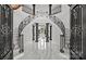 Grand foyer featuring detailed ironwork staircase and marble flooring at 355 Pelham Ln, Mooresville, NC 28115