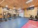 Home gym featuring Rogue equipment, weights, rubber flooring, and an American flag at 355 Pelham Ln, Mooresville, NC 28115