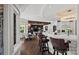 Bright kitchen featuring a breakfast bar with seating, modern lighting, and an open layout to the dining area at 355 Pelham Ln, Mooresville, NC 28115