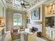 Cozy living room with a fireplace, built-in bookshelves, a decorative ceiling, and comfortable seating at 355 Pelham Ln, Mooresville, NC 28115