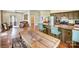 Spacious living room with modern decor flowing into a rustic-styled kitchen and concrete floors at 355 Pelham Ln, Mooresville, NC 28115