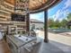 Stylish outdoor dining area with a large table, comfortable seating, and views of the pool at 355 Pelham Ln, Mooresville, NC 28115