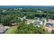 An aerial view of several homes in a wooded community with well-manicured lawns at 3622 46Th Ne Ave, Hickory, NC 28601