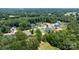 An aerial view shows homes in a community surrounded by dense trees and greenery at 3622 46Th Ne Ave, Hickory, NC 28601