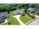 Aerial view of a house with a long driveway and lush landscaping, surrounded by trees at 3622 46Th Ne Ave, Hickory, NC 28601