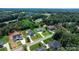 Aerial shot of a suburban home with a large, green yard surrounded by mature trees at 3622 46Th Ne Ave, Hickory, NC 28601