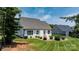 Nice backyard with healthy lawn, a concrete patio, and strategically placed shrubs at 3622 46Th Ne Ave, Hickory, NC 28601