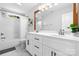 A bright bathroom featuring a double vanity with modern fixtures, and tub with shower at 3622 46Th Ne Ave, Hickory, NC 28601