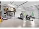 Spacious garage with epoxy floors, overhead storage, and ample room for a home gym at 3622 46Th Ne Ave, Hickory, NC 28601