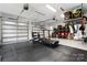 Clean garage space with black rubber flooring, overhead storage, and garage door windows at 3622 46Th Ne Ave, Hickory, NC 28601
