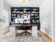 A home office with custom blue built-ins and shelving and modern desk at 3622 46Th Ne Ave, Hickory, NC 28601