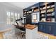 A home office with custom blue built-ins and shelving and modern desk at 3622 46Th Ne Ave, Hickory, NC 28601