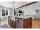 Kitchen island featuring stainless steel appliances, and a view into the living room at 3622 46Th Ne Ave, Hickory, NC 28601
